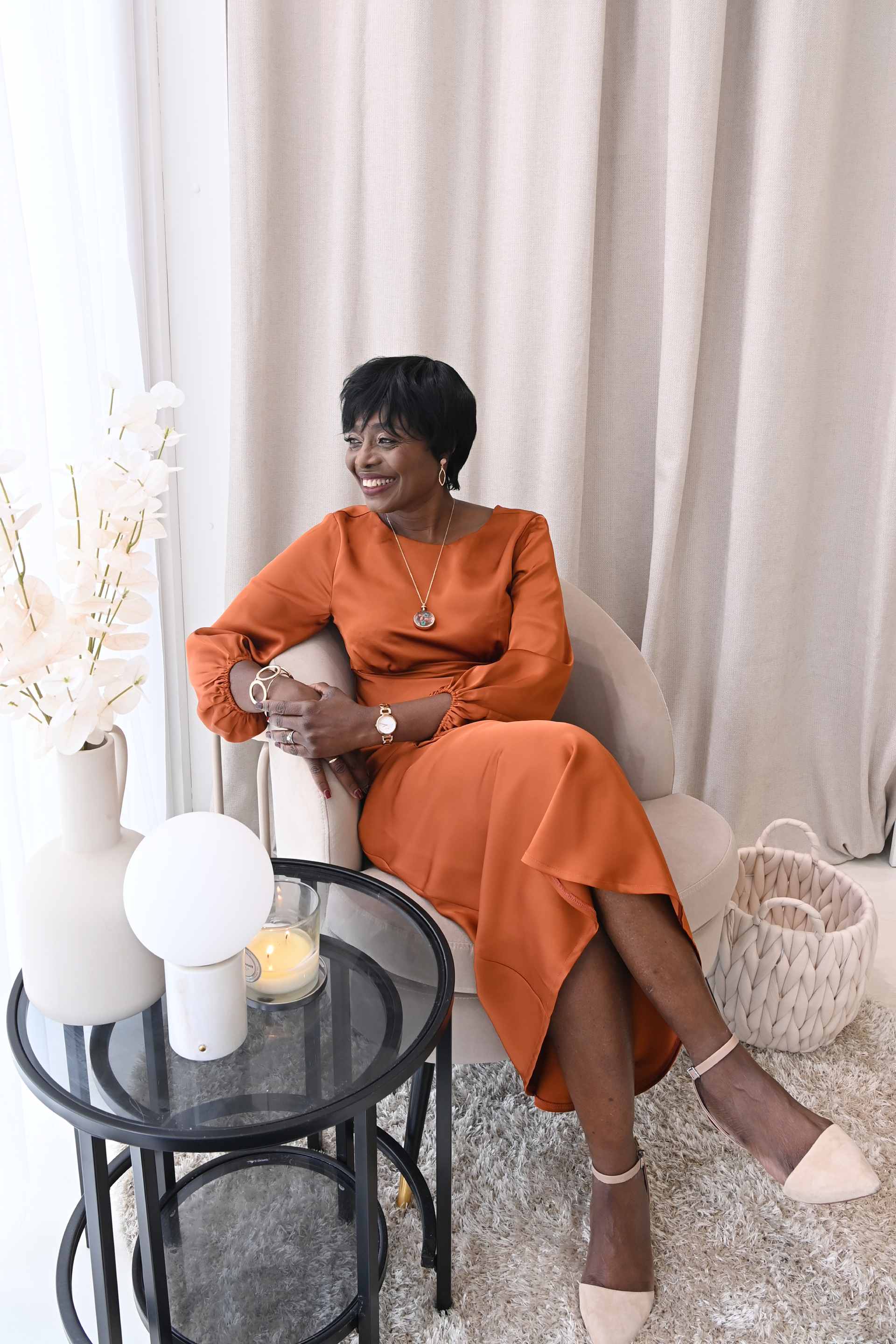 Woman sitting in stylish chair